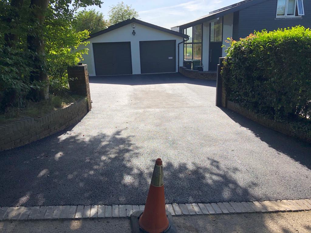 This is a photo of a bitumen driveway which is in the process of being installed by Little River Road Tech