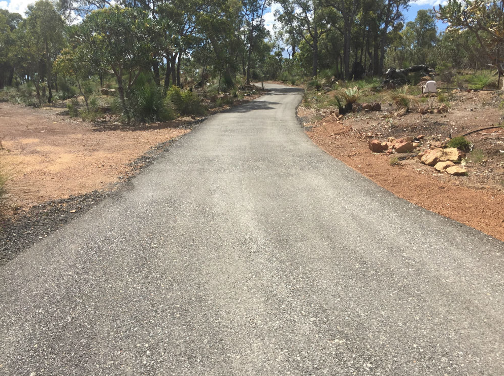 This is a photo of a hot spray & seal bitumen driveway which is in the process of being installed by Little River Road Tech