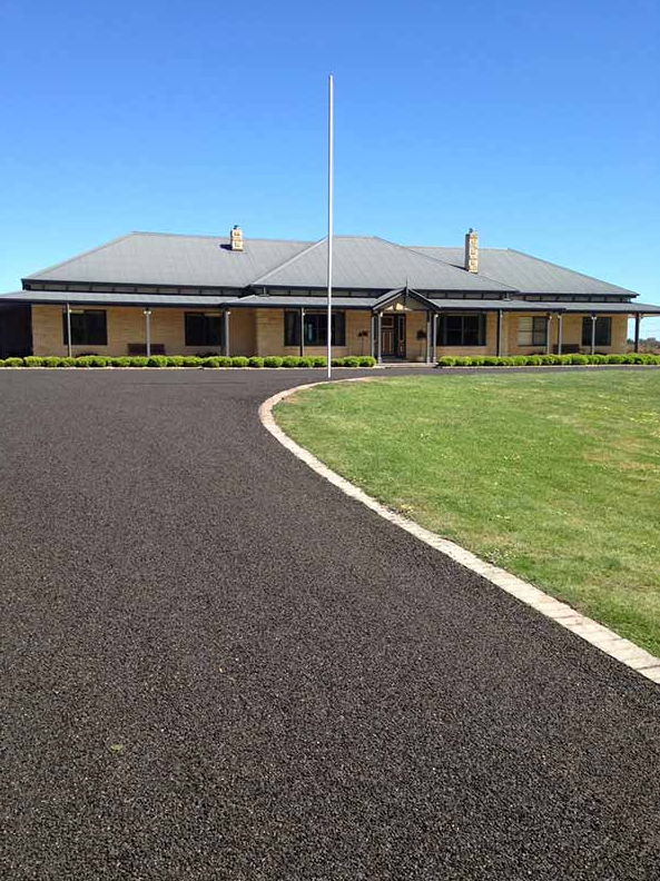 This is a photo of an asphalt driveway which has been installed by Little River Road Tech